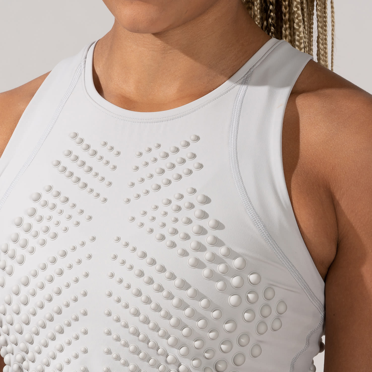 Close-up Front view of Female wearing OMORPHO Cloud G-Crop weighted top