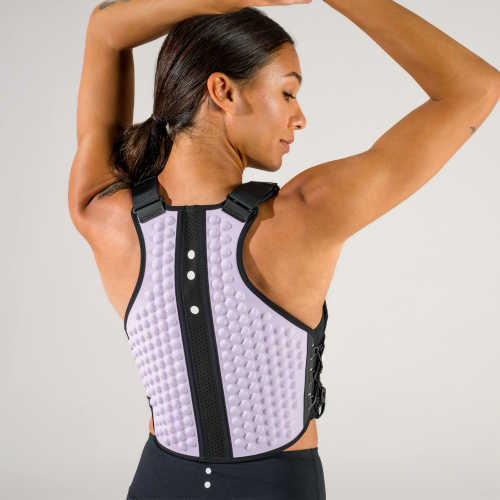 Back view of woman with arms overhead in a weight vest in lavender color from OMORPHO