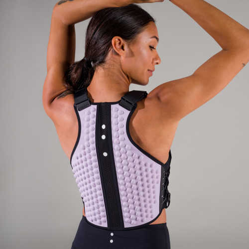 Back view of woman with arms overhead in a weight vest in lavender color from OMORPHO