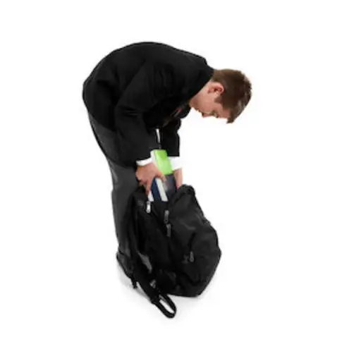 Packing school bag with books
