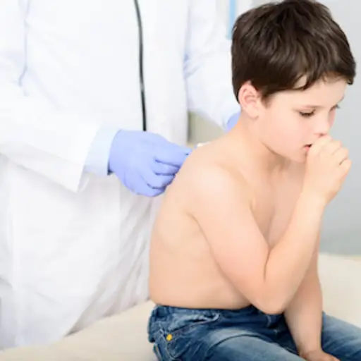 Child at doctors office being checked for upper respiratory infection.