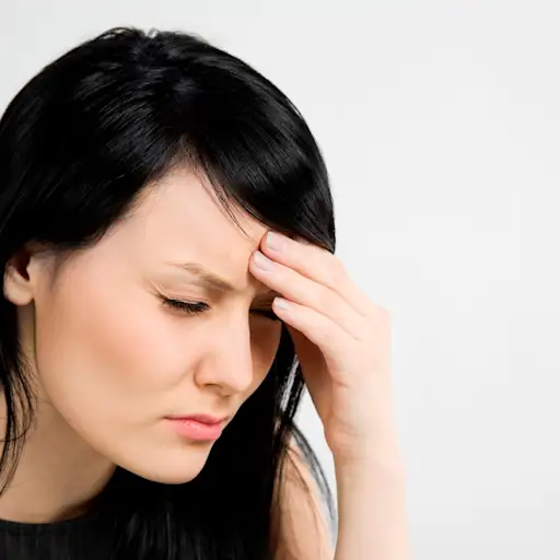 Young woman with headache and stress.