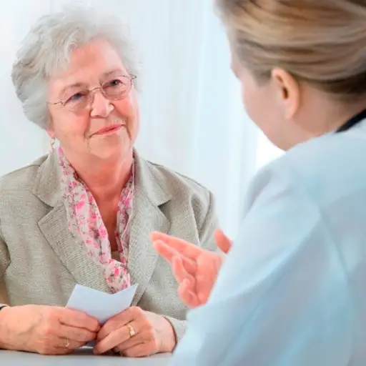Doctor talking to senior woman.
