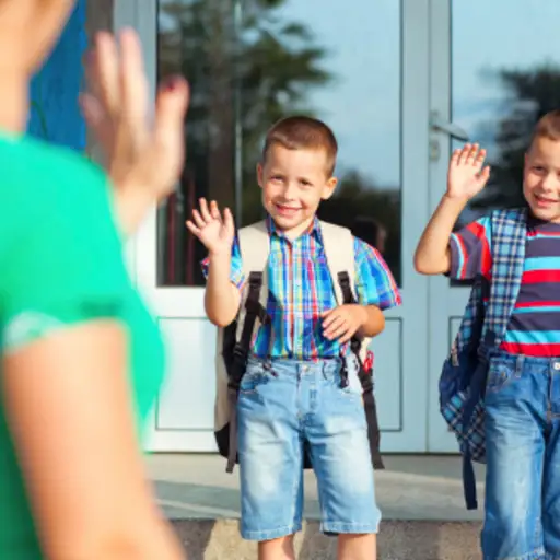 Parent waving goodbye to children.