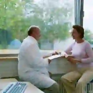 woman talking to doctor image