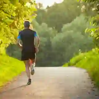 Man runs up a hill.