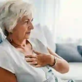 senior woman with chest pain