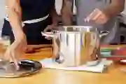 close up of couple cooking