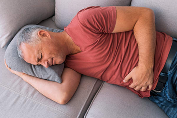 Senior man with gut pain.