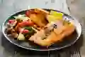 A view of a plate with salmon and vegetables