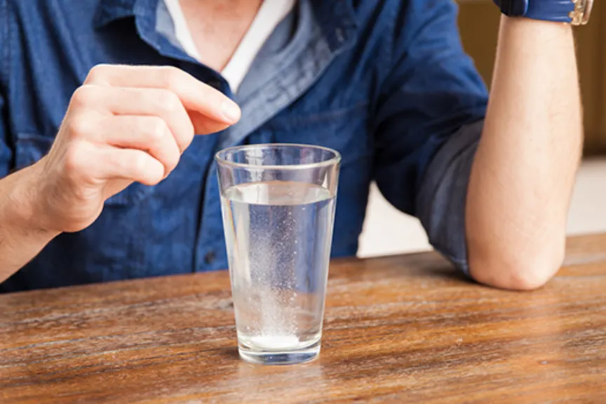 Tablet dissolving in a glass of water