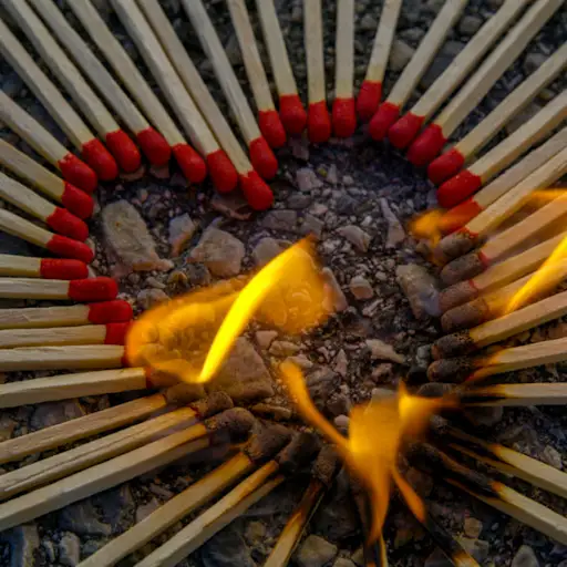 Heart shape arranged with burning matches