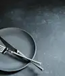 Cutlery on an empty plate