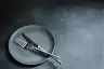 Cutlery on an empty plate