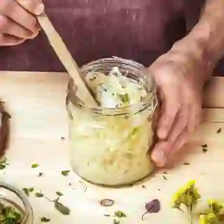 A view of someone making sauerkraut