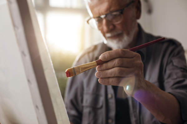 senior man painting