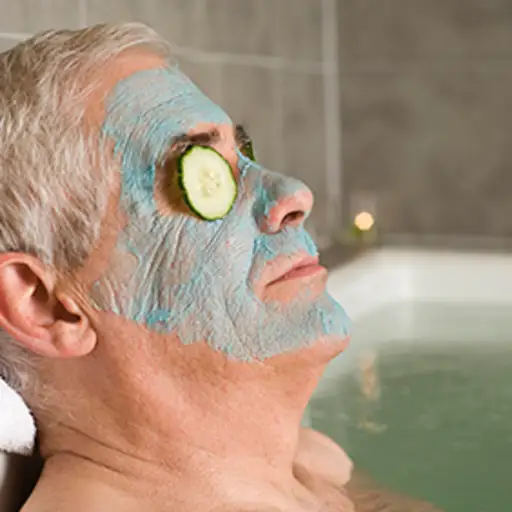 Man wearing a face mask relaxing in the bath.