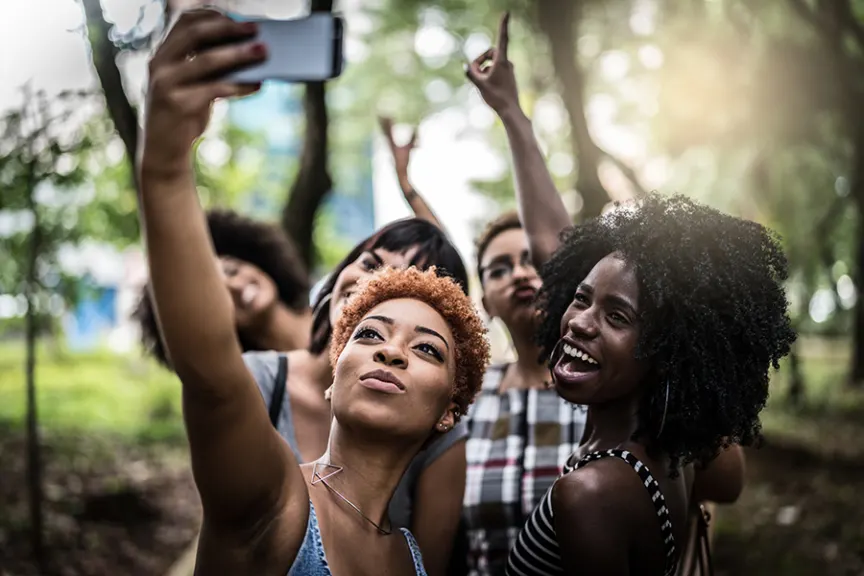 Group of young, happy, strong, black friends taking a selfie.