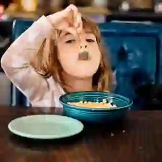 child eating cereal