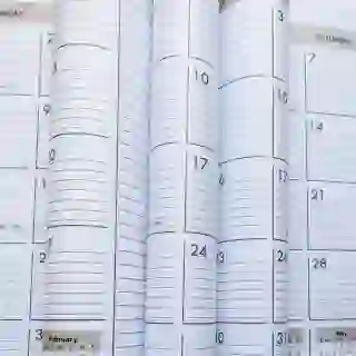 Various pages of calendars with lines to make notes on