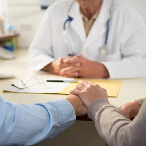 Worried couple with a doctor.