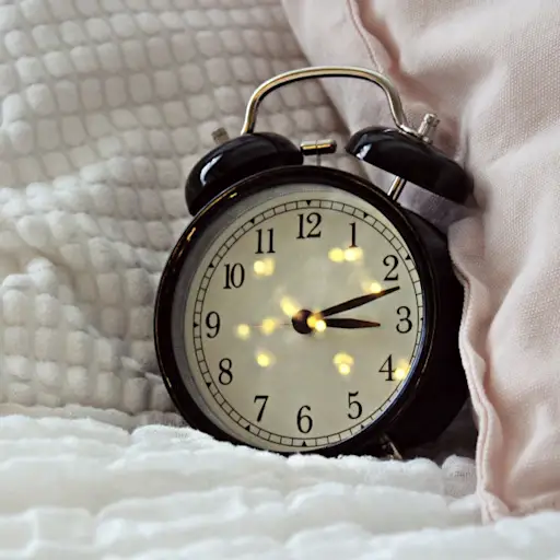 alarm clock on bed