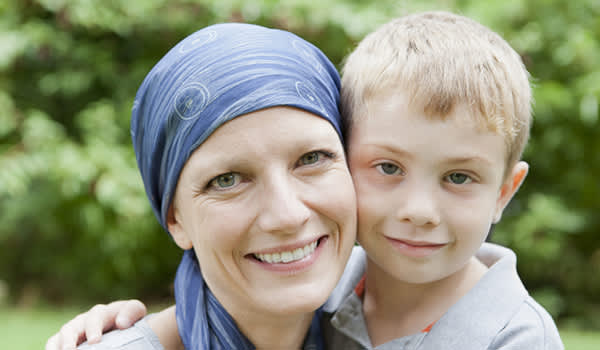 Mother with cancer poses with her young son.