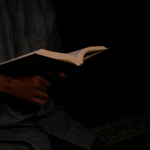 man reading in dim light