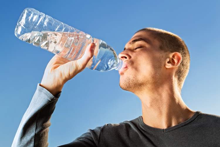 Man drinking bottled water.