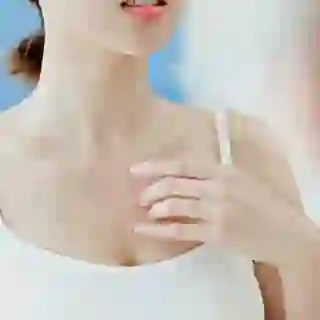 woman scratching chest