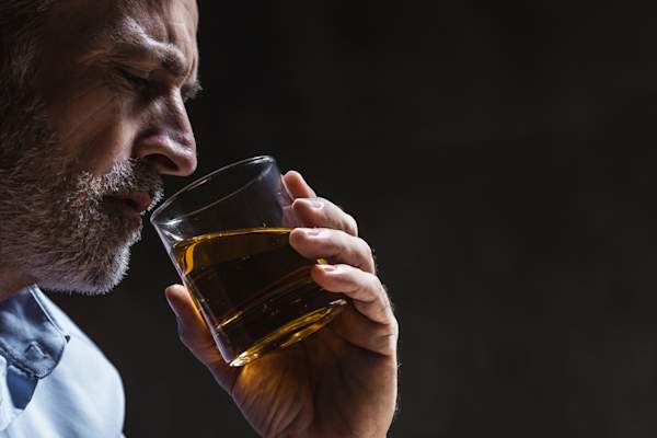 older man drinking alcohol