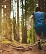 Man trail running in the forest