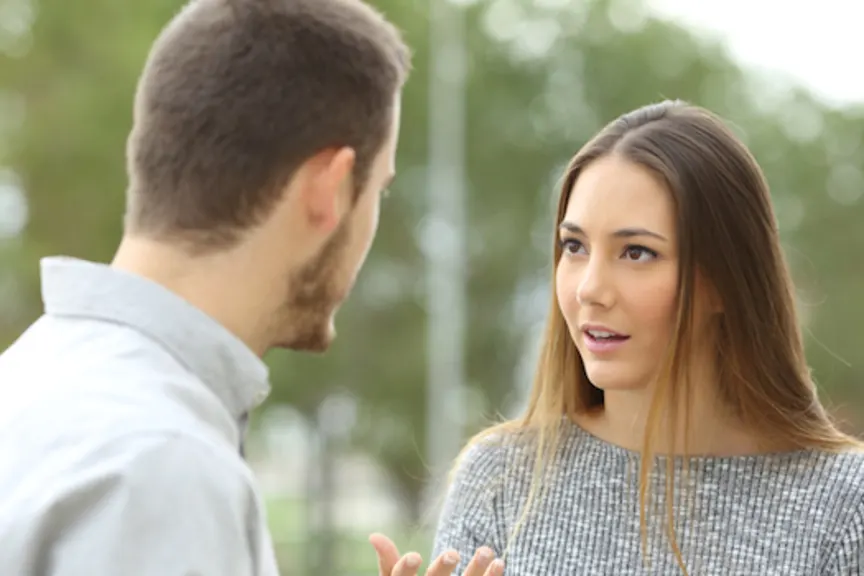 man and woman talking