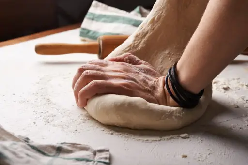hands kneading bread