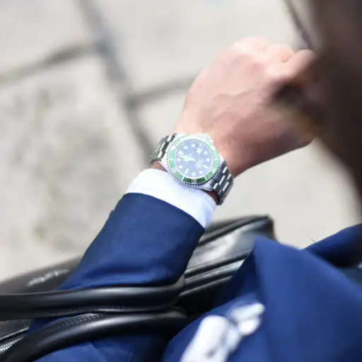 businessman looking at watch