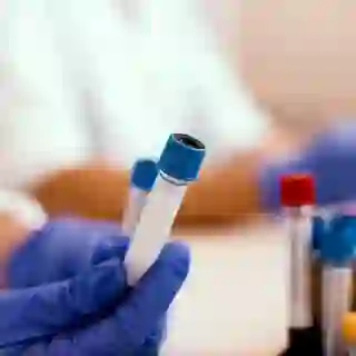 scientist holding blood sample