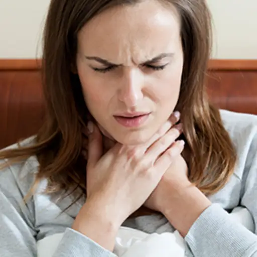 Woman with a sore throat.