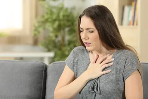 Woman experiencing shortness of breath.