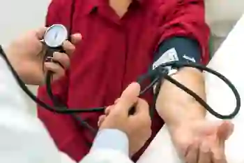 A doctor takes a patient’s blood pressure