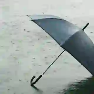 Open umbrella laying on ground