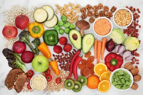 Colorful photo of foods low on the glycemic including fruits, vegetables, and legumes.
