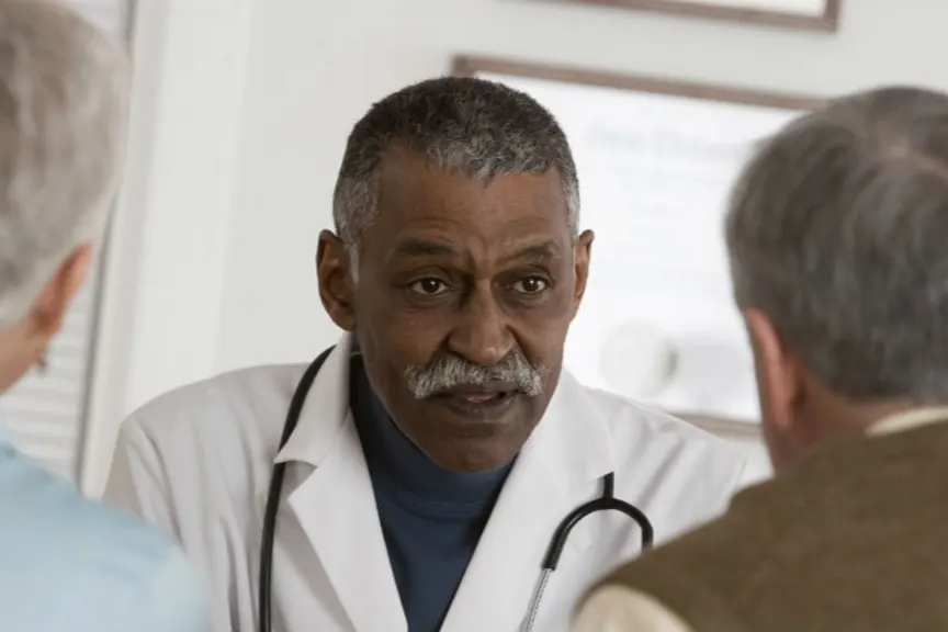 woman talking to doctor