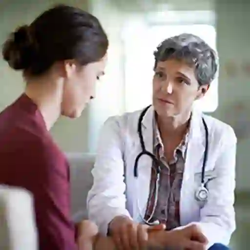 Doctor comforting a patient.
