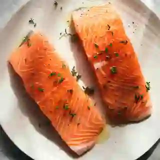 An overhead view of a plate of raw salmon