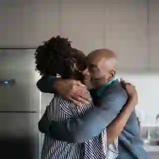 middle-aged couple hugging