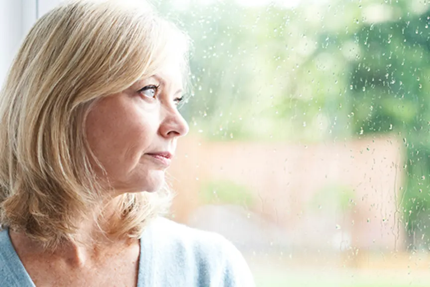 woman looking out window
