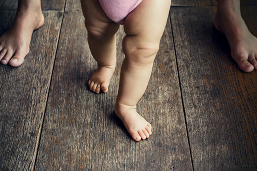Baby taking her first steps.