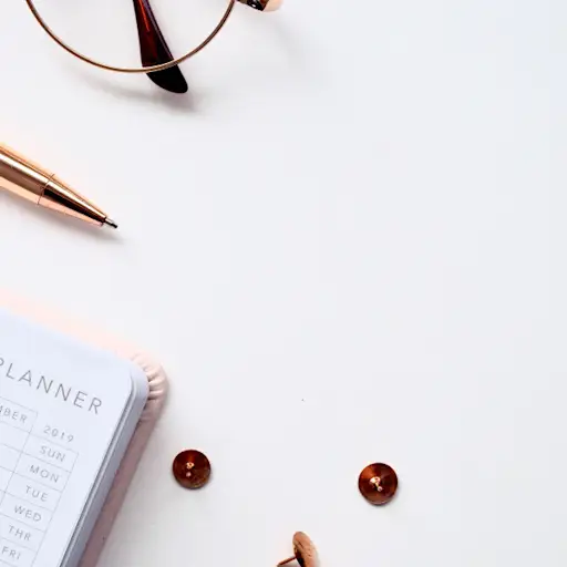 yearly planner next to glasses