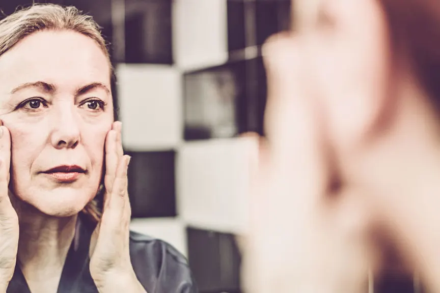 woman applying skin cream
