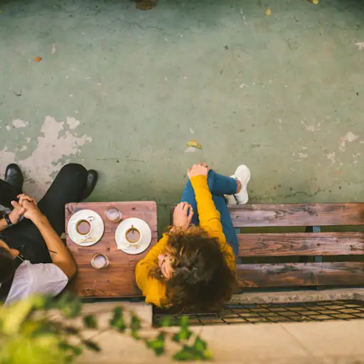 overhead view of two people talking outside